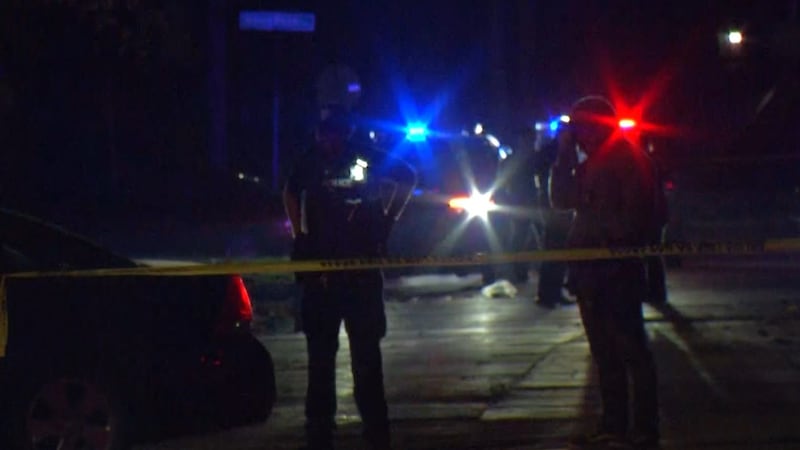 Police at the scene of a shooting at Mershon and Cooper in Saginaw on Friday, Oct. 23