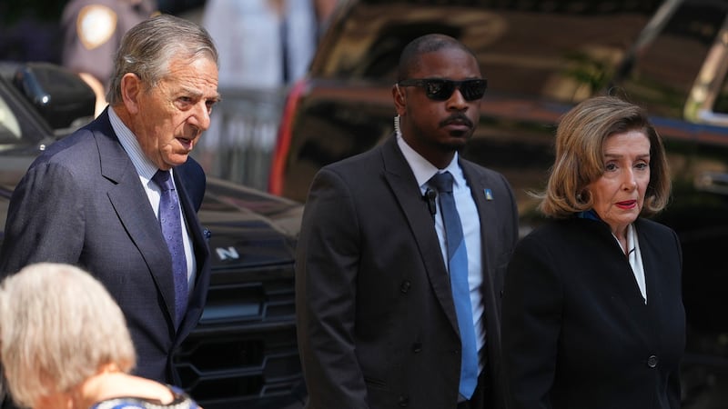 Rep. Nancy Pelosi, D-Calif., and her husband Paul arrive at the funeral services for Clive...
