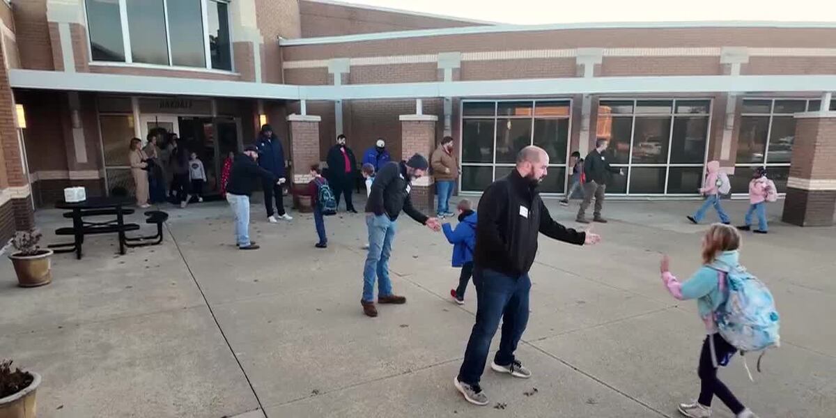 Line Up Elementary Fathers line up regularly at elementary school to create positive ...
